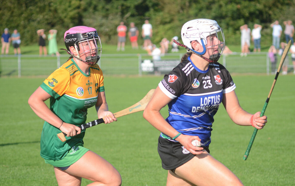 Sinead Hurley of Sarsfields pulls away from Cloughduv's Clodagh Sheppard. Picture: Howard Crowdy Sinead Hurley of Sarsfields pulls away from Cloughduv's Clodagh Sheppard. Picture: Howard Crowdy