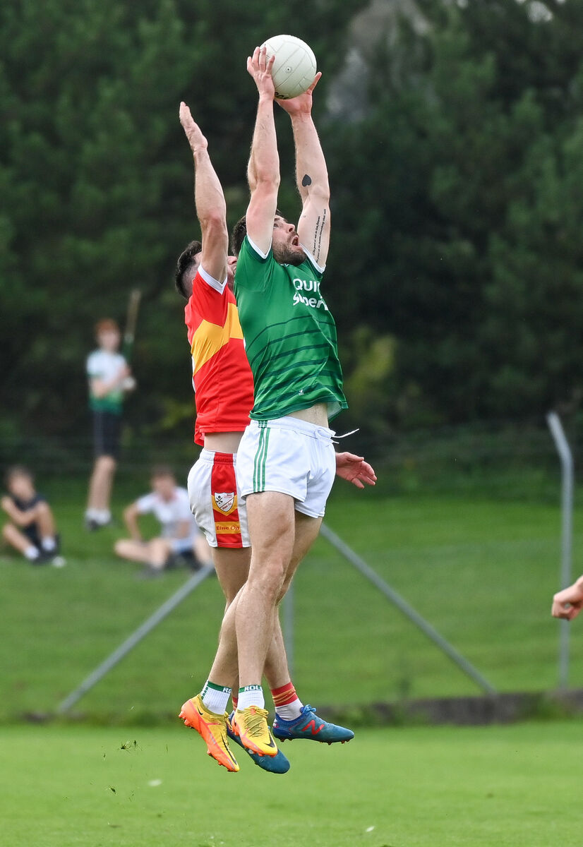  Ballincollig's Peter O'Neill wins possesion ahead of Éire Óg's Dermot Herlihy, during their Premier SFC clash at Coachford. Picture: David Keane