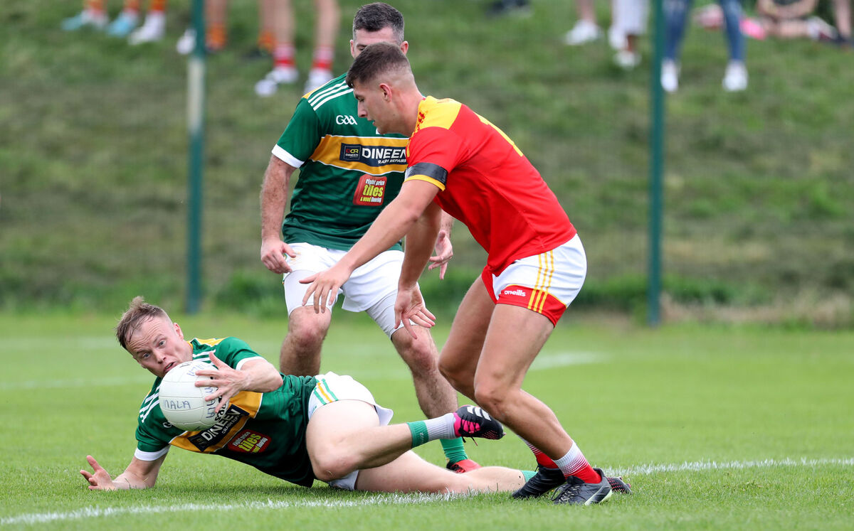  Sean McDonnell, Mallow,  battling Eric Hegarty and Sean Keating, St Michael's. Picture: Jim Coughlan.