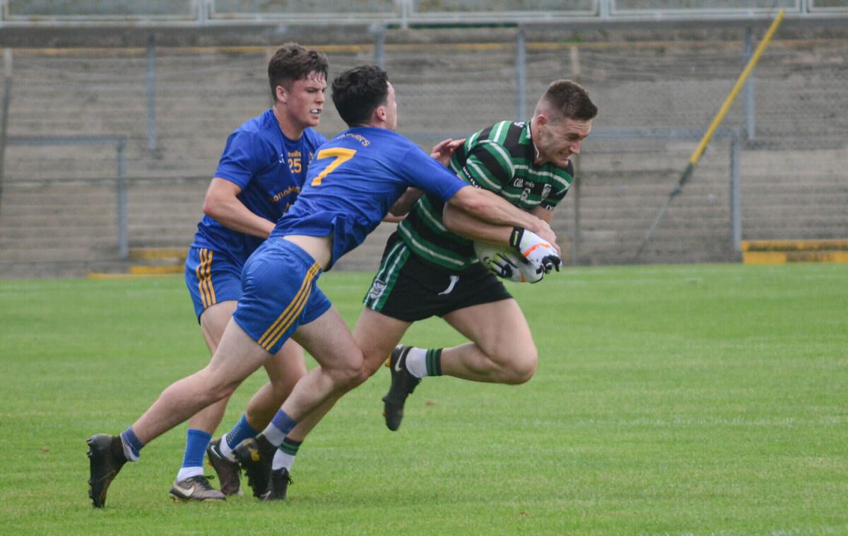 Douglas' Kevin Flahive is challenged by St Finbarr's John Wiggington Barrett and Colm Scully. Picture: Howard Crowdy Douglas' Kevin Flahive is challenged by St Finbarr's John Wiggington Barrett and Colm Scully. Picture: Howard Crowdy