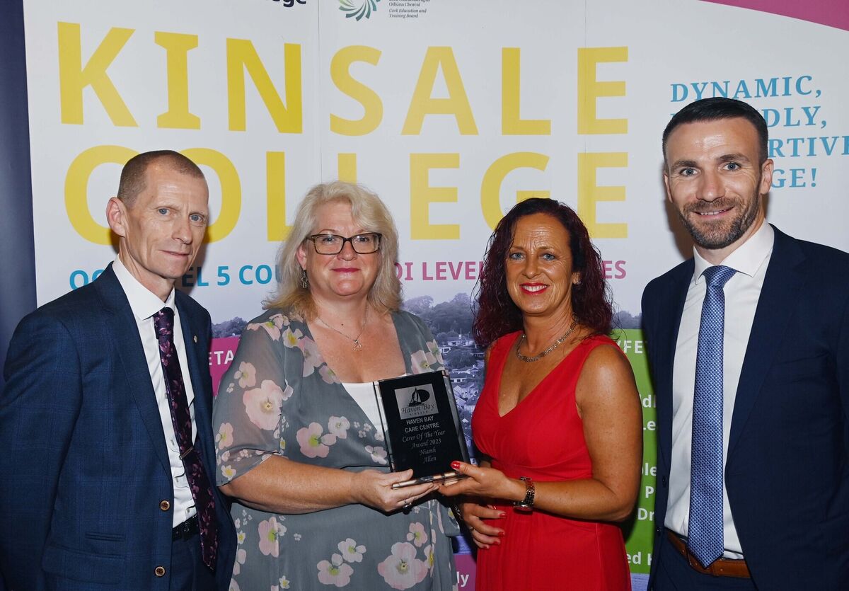 Deirdre Mullins, Haven Bay Care Centre, (second left) presenting the Carer of the Year award to Niamh Allen at the Class of 2023 Kinsale Campus graduation ceremony at Actons Hotel, Kinsale, in the presence of John Fitzgibbons, director, FET, Cork ETB, (left) and Martin Coleman, director, Kinsale Campus.