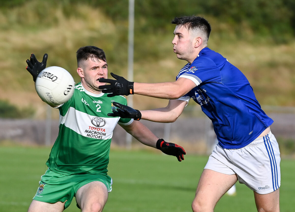 Naomh Abán's Jack O'Donoghue gets his pass away as Macroom's Ciaran Condon closes in, during their PIFC clash this season at Cill na Martra. Picture: David Keane Naomh Abán's Jack O'Donoghue gets his pass away as Macroom's Ciaran Condon closes in, during their PIFC clash this season at Cill na Martra. Picture: David Keane