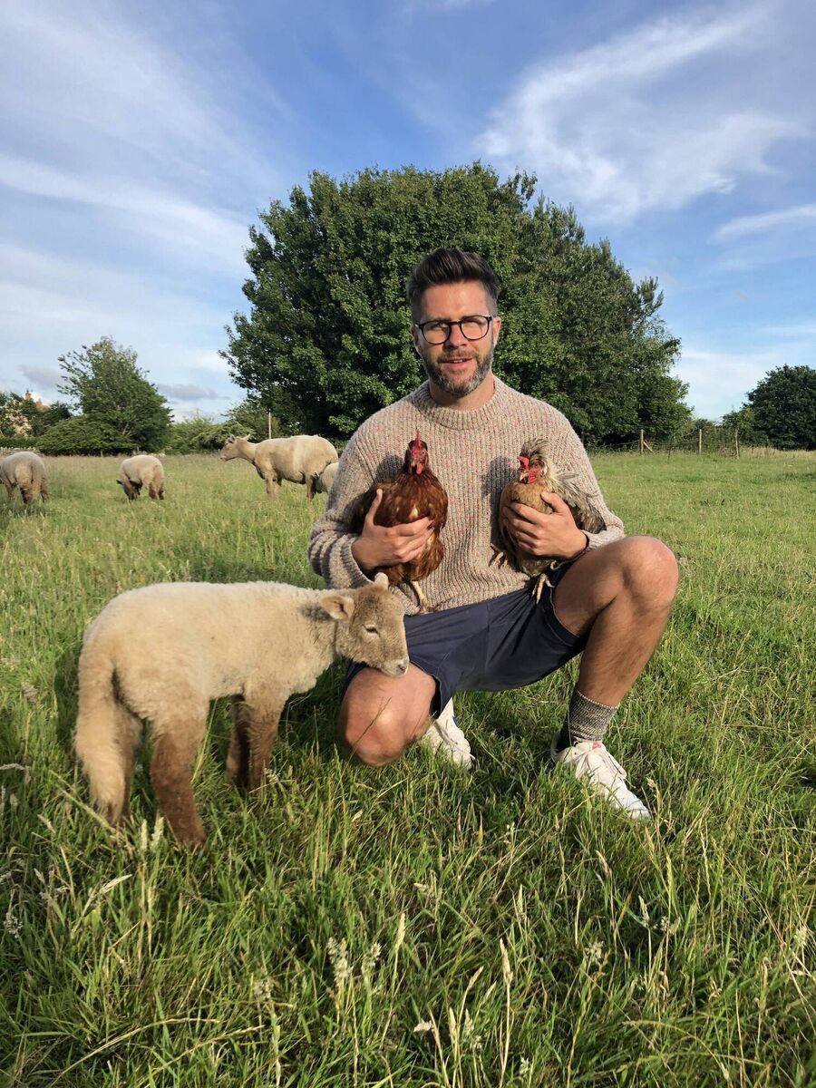 James Greenwood with sheep and chickens. Picture: James Greenwood/PA Photo. James Greenwood with sheep and chickens. Picture: James Greenwood/PA Photo.