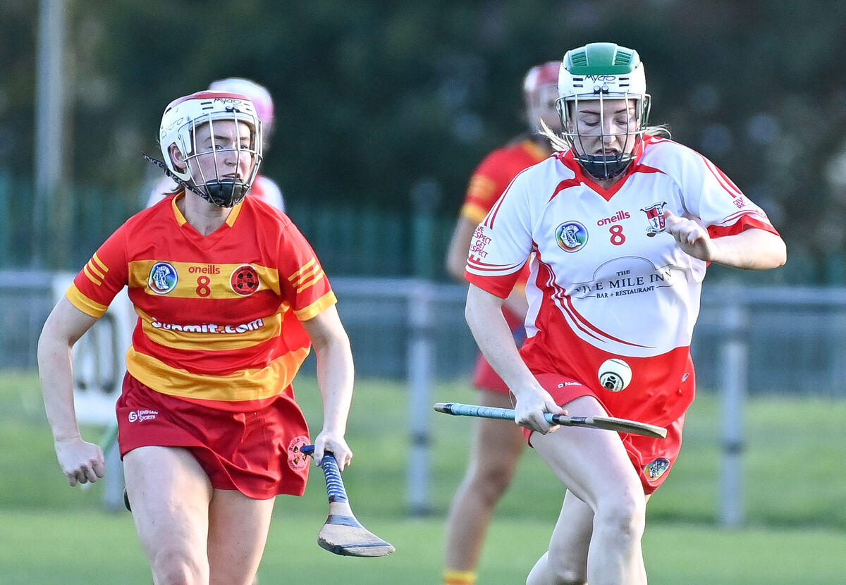  Ballygarvan's Izzy O'Regan races away from Newcestown's Emma Tarrant, during their SE Systems Senior Camogie Championship clash at Castle Road.