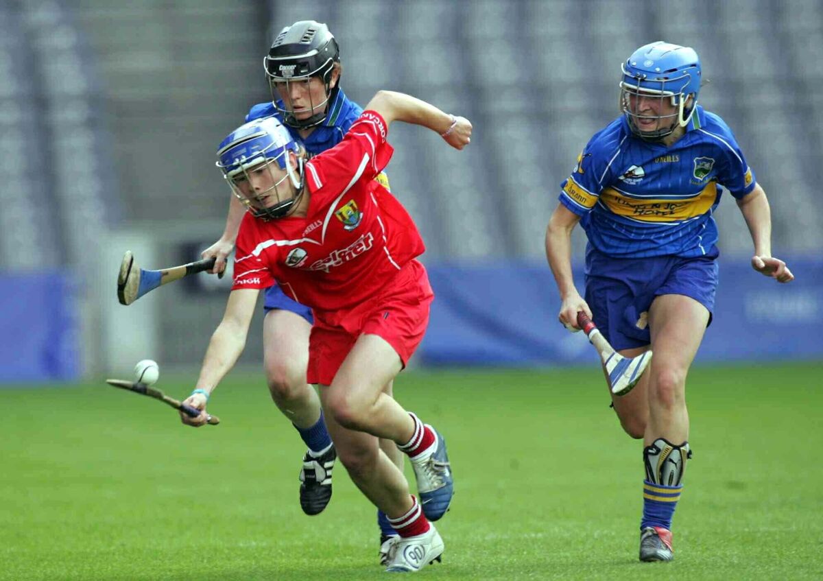 Claire Grogan and Angie McDermott of Tipperary tackle Rena Buckley of Cork in the 2005 final Claire Grogan and Angie McDermott of Tipperary tackle Rena Buckley of Cork in the 2005 final