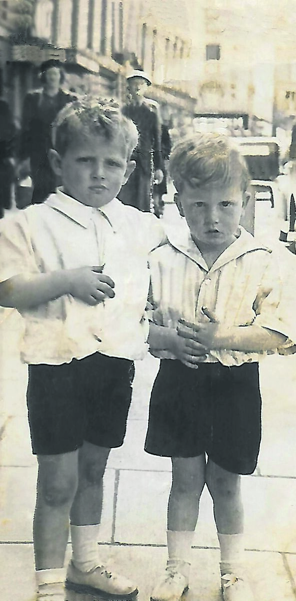 Throwback Thursday reader Pat Kelly (right) sent in this photo of himself with his brother at the Victoria Hotel in Patrick Street in 1947, taken by a street photographer. Behind them was 50 Shilling Tailors, later to be Porters newsagents