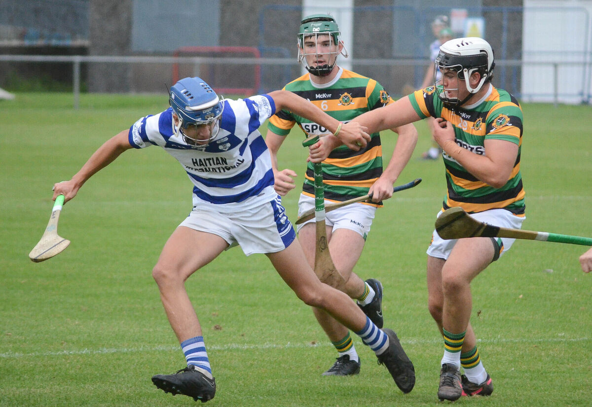 Inniscarra's Alan Heelan attempts to pull away from Glen Rovers' Jake Brosnan and Craig Hughes. Picture: Howard Crowdy