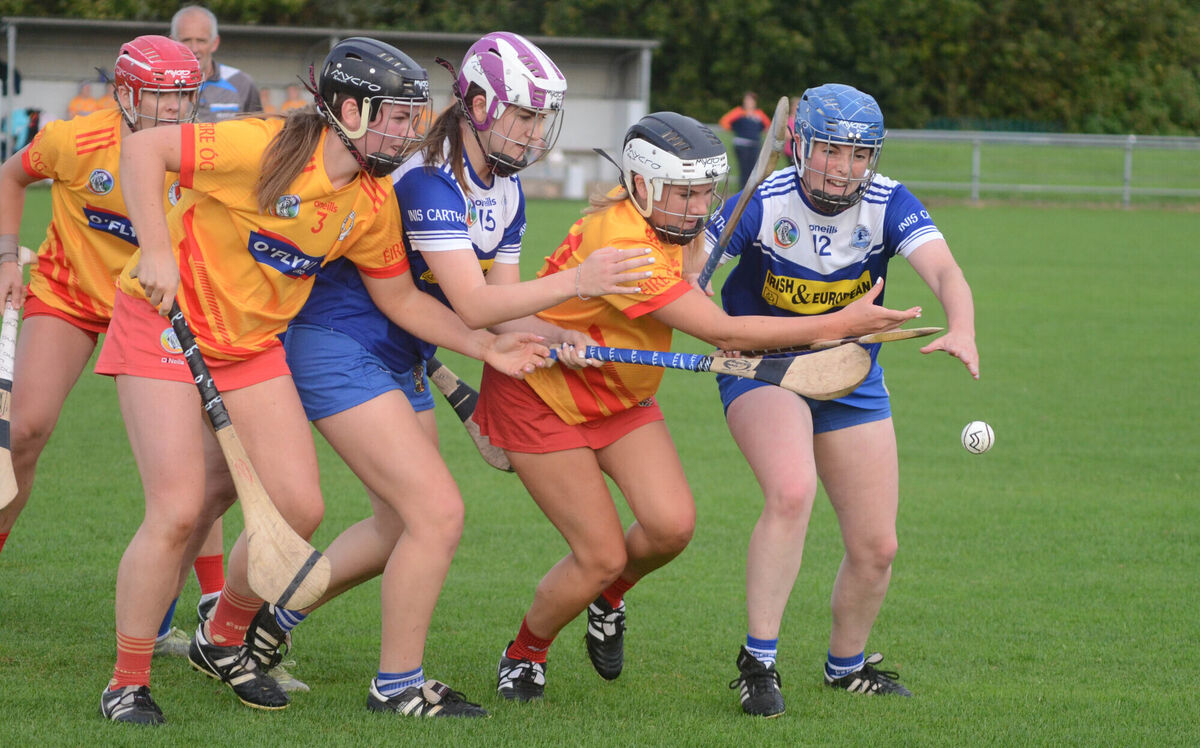 Rebecca Murphy and Caitlin Looney of Inniscarra with Éire Óg's Fiona Murphy and Emma Quigley reach out for the sliothar. Picture: Howard Crowdy Rebecca Murphy and Caitlin Looney of Inniscarra with Éire Óg's Fiona Murphy and Emma Quigley reach out for the sliothar. Picture: Howard Crowdy