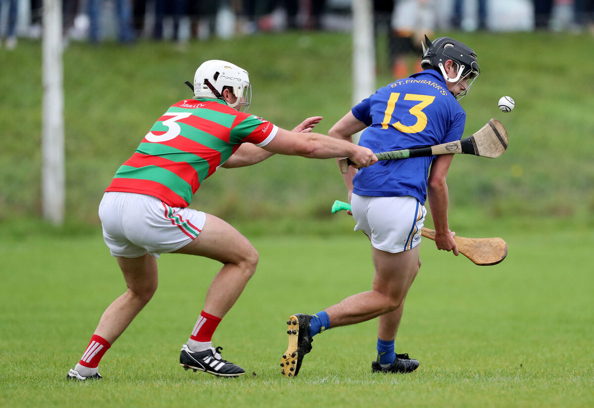 Kelvin Healy, Tracton, tackles David Murray, St. Finbarr's, in the Premier Junior relegation playoff at Ballygarvan. Picture: Jim Coughlan. Kelvin Healy, Tracton, tackles David Murray, St. Finbarr's, in the Premier Junior relegation playoff at Ballygarvan. Picture: Jim Coughlan.