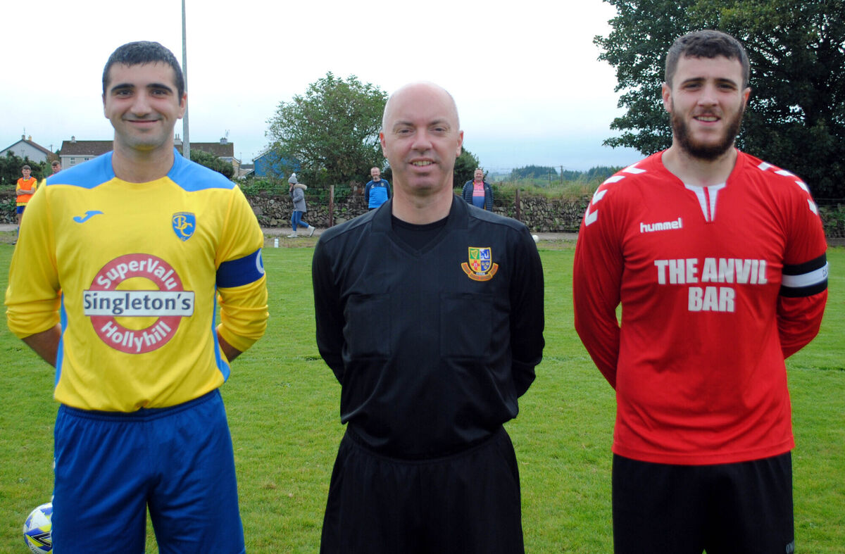 Rylane Celtic's captain Shaun Lane (right) and Bweeng Celtic's Eric Fitzgerald, accompanied by referee Grahame Duffy.