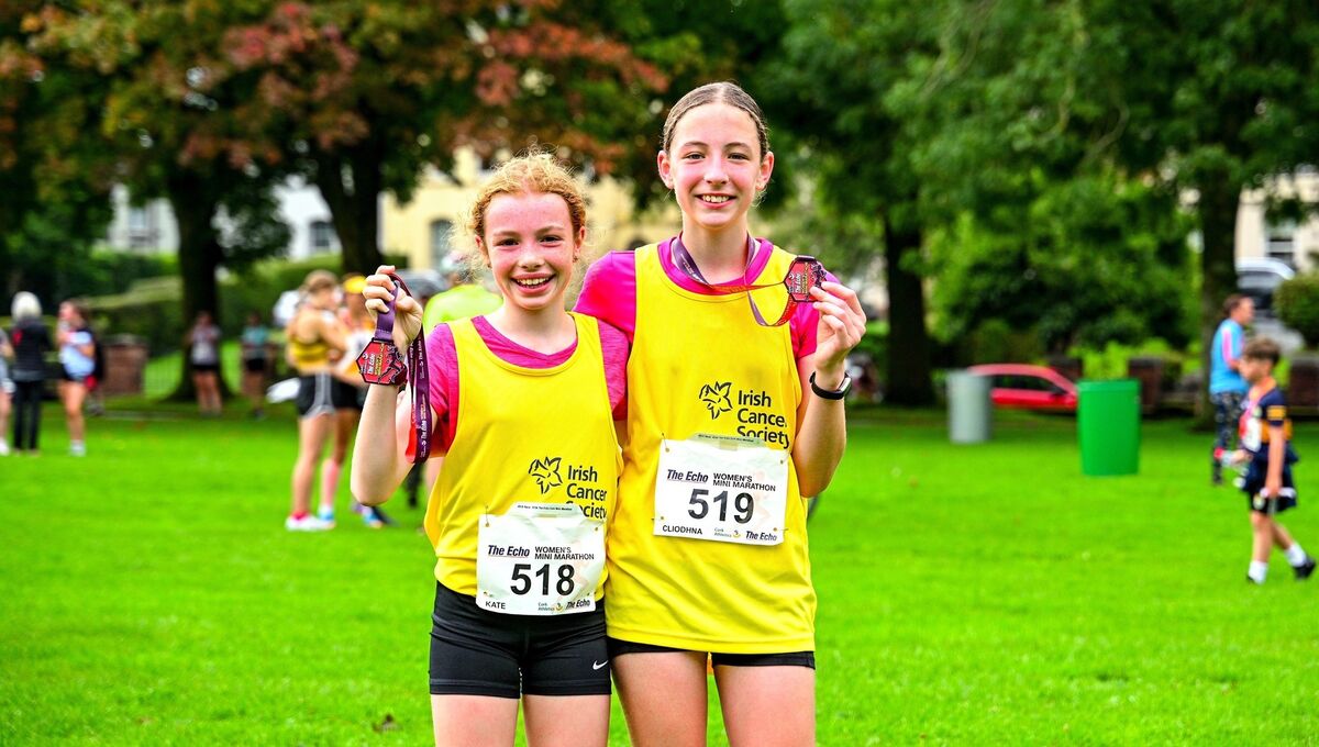 Kate Walsh (13) and Cliondhna Walshe (12) celebrating following this year's Echo Mini Marathon which they participated in on behalf of Irish Cancer Society. Kate Walsh (13) and Cliondhna Walshe (12) celebrating following this year's Echo Mini Marathon which they participated in on behalf of Irish Cancer Society.