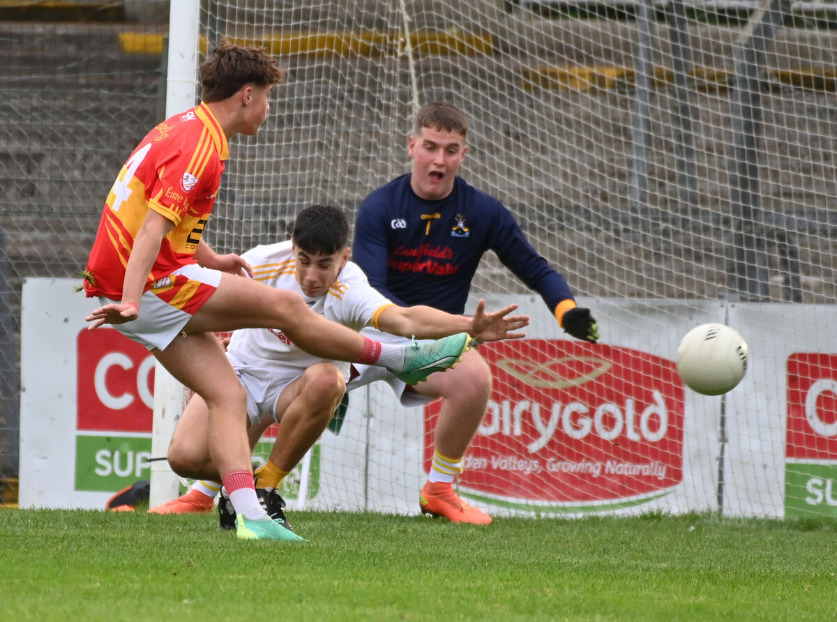 Eire Og's Johnny Galvin scores his sides second goal past Bandon goalkeeper Alan O'Reagan and James O'Driscoll during the Rebel Og Premier 2 MFC final at Pairc Ui Rinn. Picture; Eddie O'Hare Eire Og's Johnny Galvin scores his sides second goal past Bandon goalkeeper Alan O'Reagan and James O'Driscoll during the Rebel Og Premier 2 MFC final at Pairc Ui Rinn. Picture; Eddie O'Hare