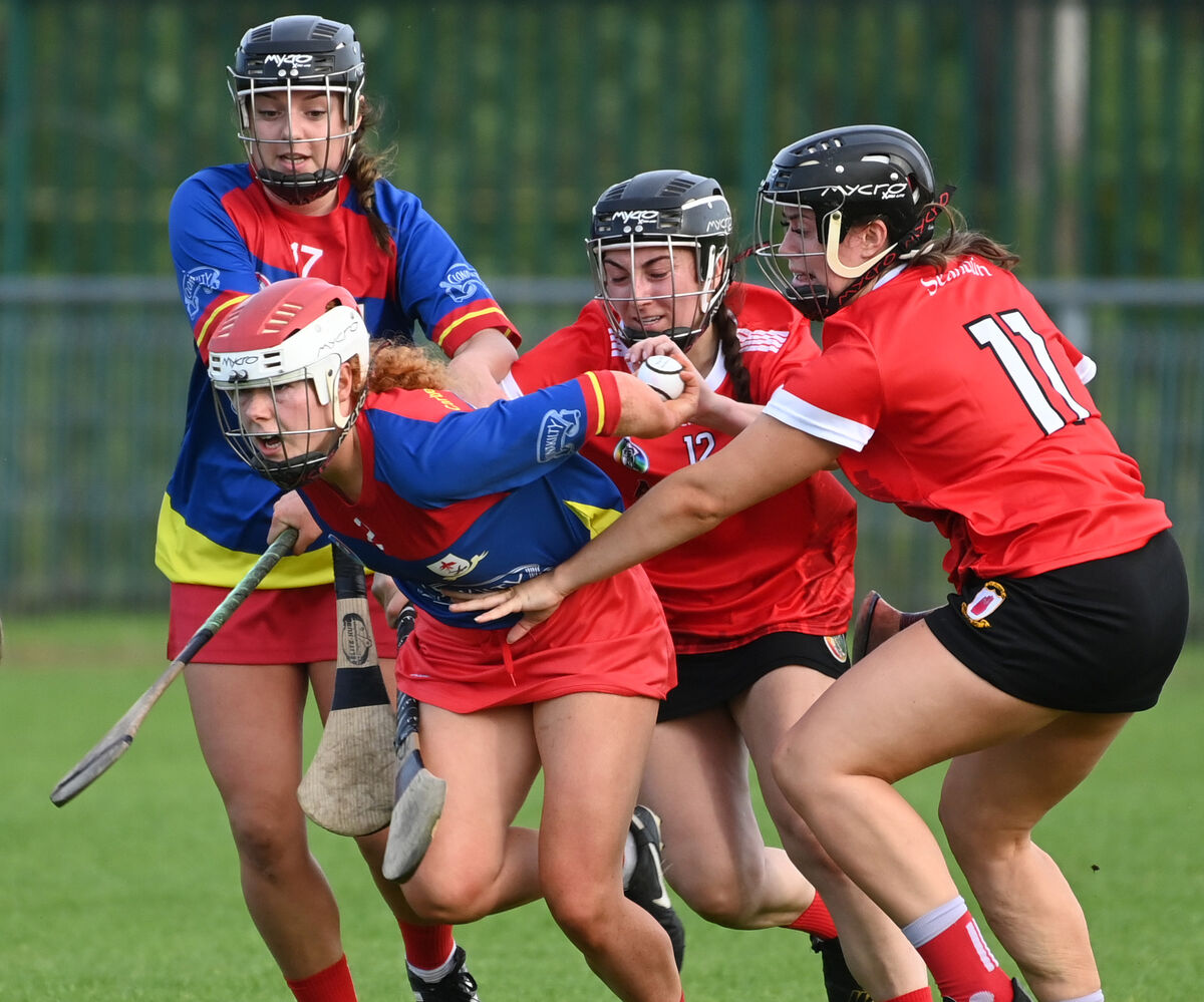 Carbery's Maggie Coppinger is tackled by Seandun's Amy O'Connor and Casey Coleman during the SE Systems Cork senior camogie championship at Castle Road.. Picture; Eddie O'Hare