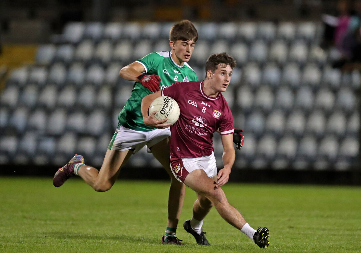  Ben O'Connell, Ballincollig, challenges Odhran Foley, Bishopstown. Picture: Jim Coughlan.