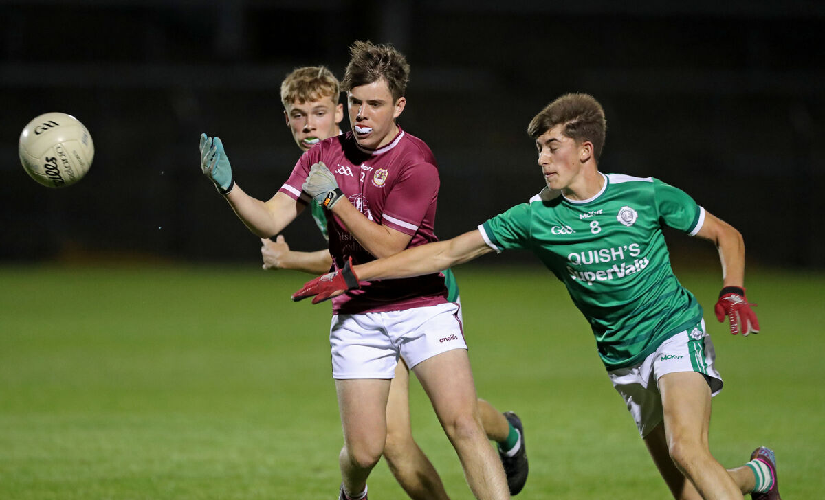  David O'Leary and Ben O'Connell, Ballincollig, close in on Darragh Griffin, Bishopstown. Picture: Jim Coughlan.