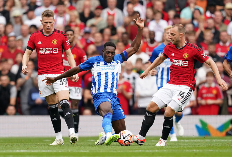 Brighton and Hove Albion's Danny Welbeck (centre) in action with Manchester United's Christian Eriksen (right) and Scott McTominay during the Premier League match at Old Trafford, Manchester. Picture: Martin Rickett/PA Wire