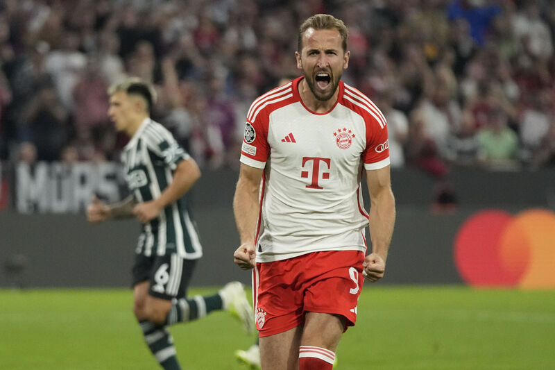 Bayern's Harry Kane celebrates after scoring his side's third goal from a penalty kick during the Champions League Group A soccer match against  Manchester United at the Allianz Arena stadium in Munich, Germany. Picture: AP Photo/Matthias Schrader