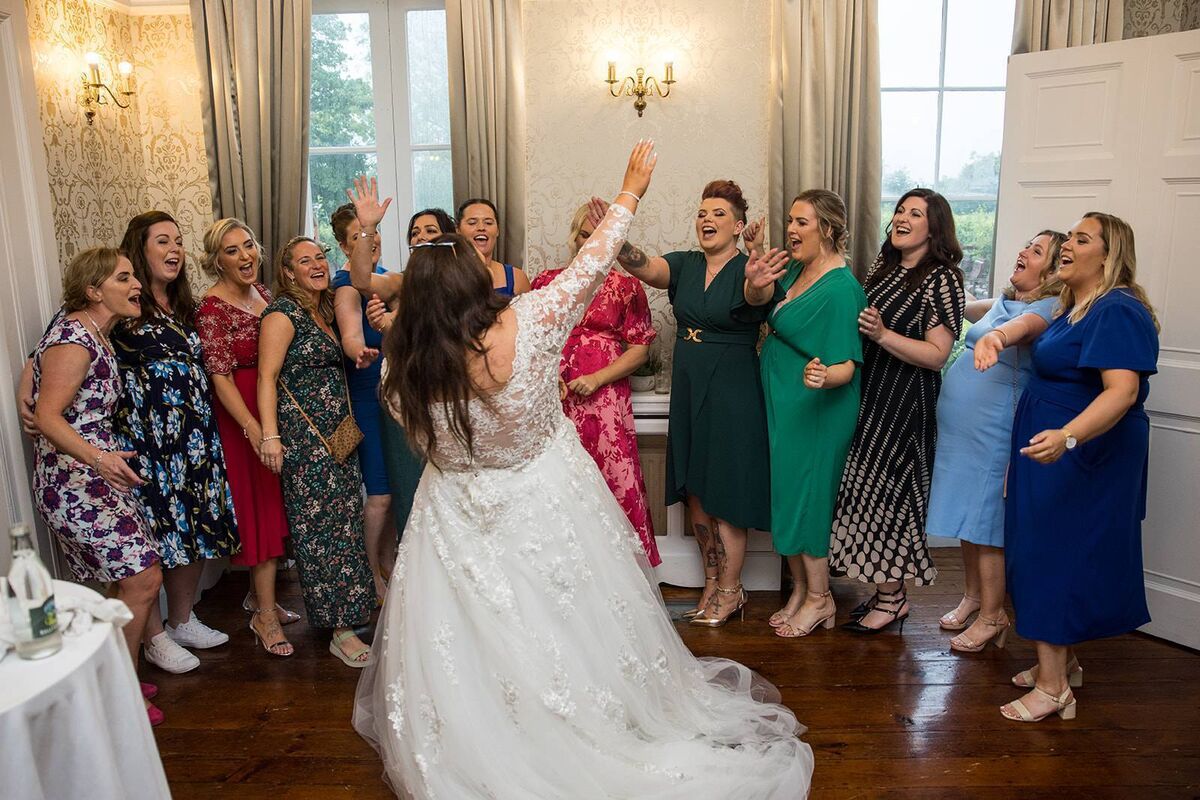 Kelly enjoying a moment with her rugby team-mates at the reception, when they sang their team song. Kelly enjoying a moment with her rugby team-mates at the reception, when they sang their team song.