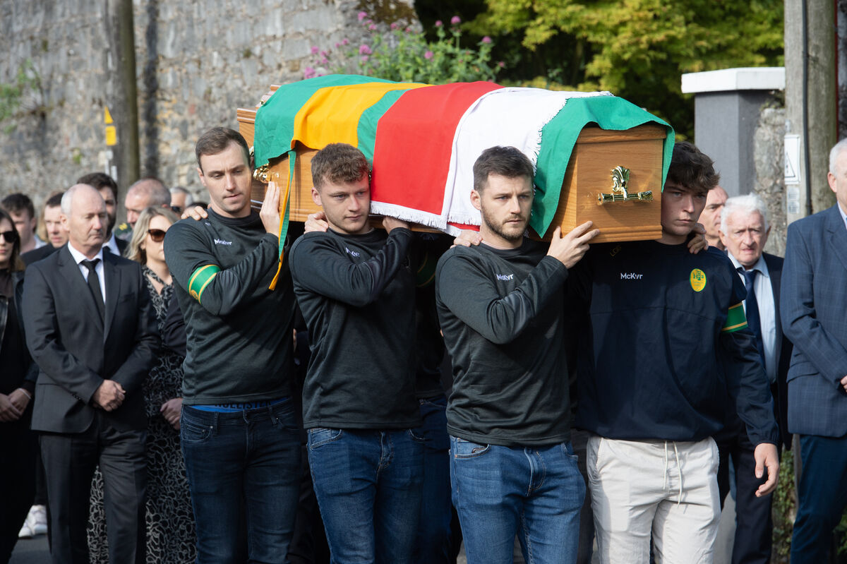  Niall Cashman, Alan Connolly, Gavin Connolly and Lee O'Sullivan of the Blackrock senior team shoulder the coffin of Jimmy Brohan. Picture: Dan Linehan