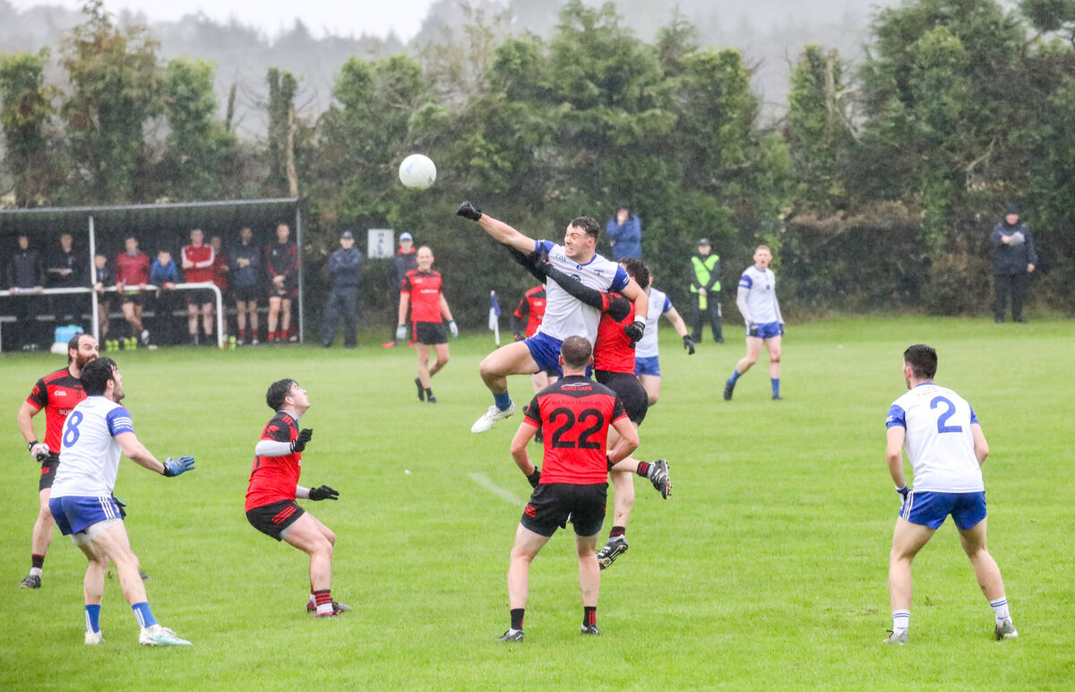 Knocknagree's Daniel O'Mahony is held as he jumps for the ball. Picture: David Creedon