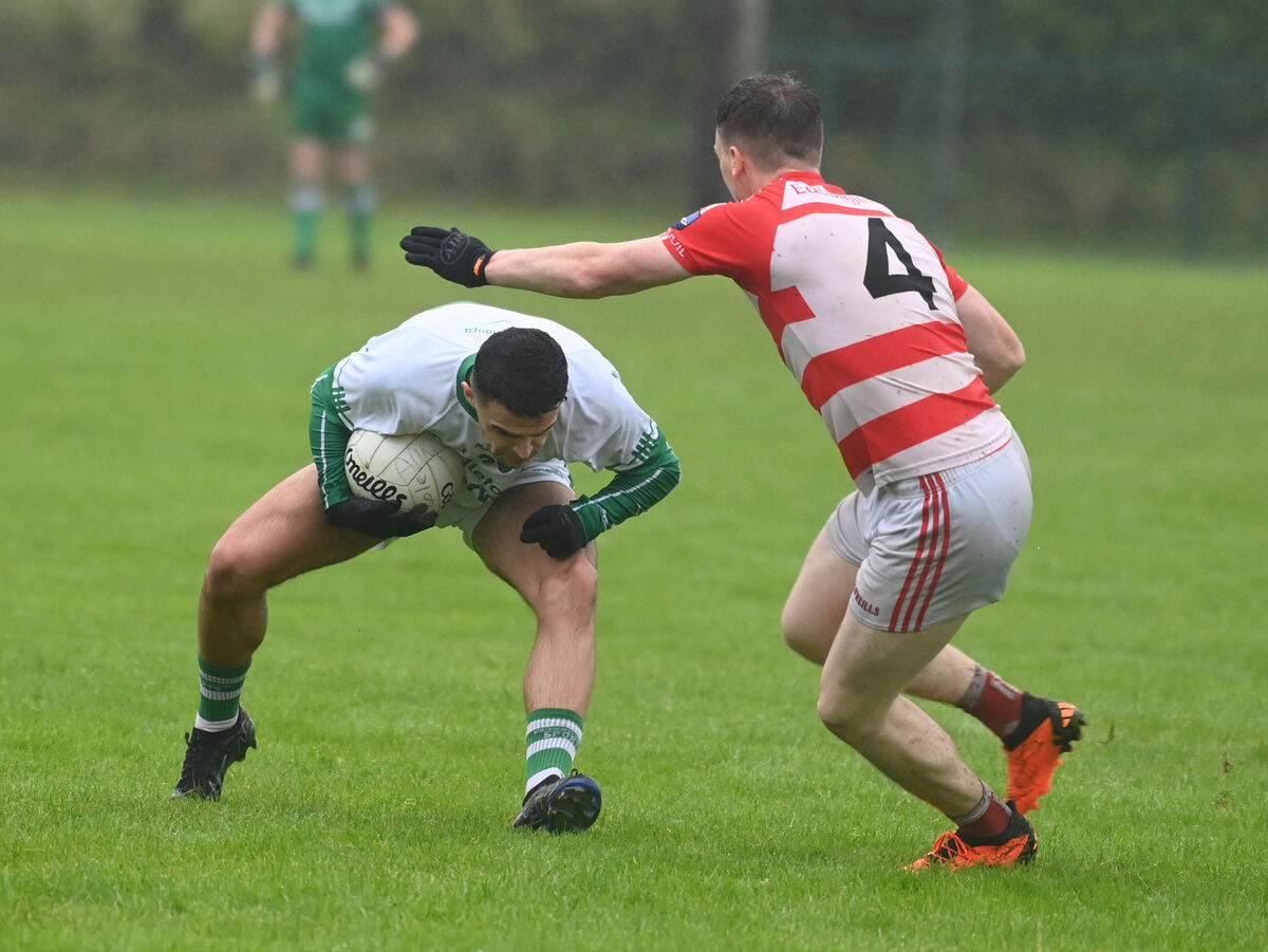 St Vincent's Benjamin Long takes on Adrigole's David Harrington. Picture: Eddie O'Hare