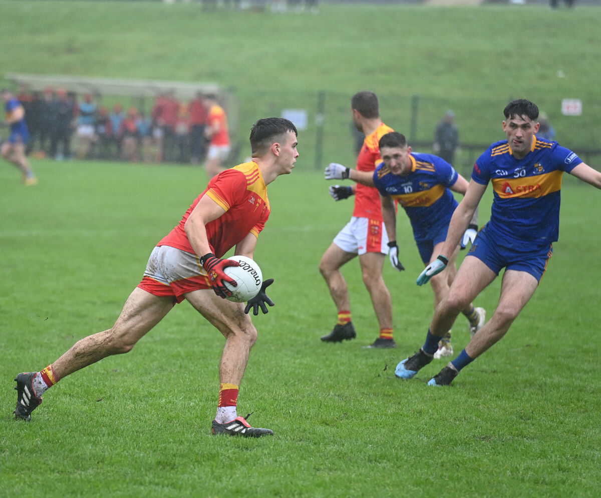 Sam Copps of Mallow looks to build an attack as Carrigaline's Brian Coakley closes in. Picture: Larry Cummins Sam Copps of Mallow looks to build an attack as Carrigaline's Brian Coakley closes in. Picture: Larry Cummins
