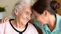 Dementia and Occupational Therapy - Home caregiver and senior adult woman