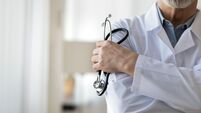 Cloe up of male doctor in white medical uniform