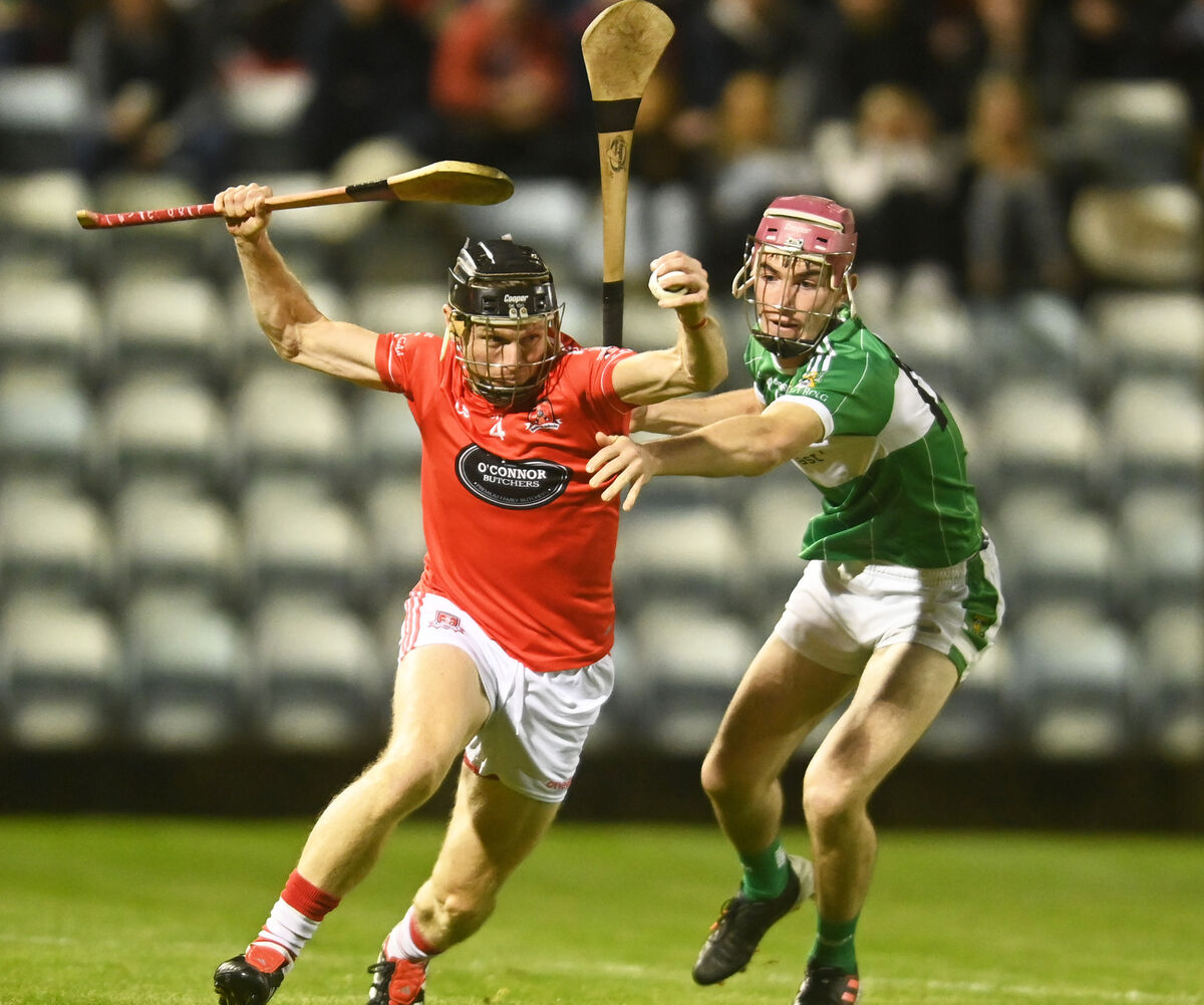 Aghabullogue's Colm Gillespie tries to put pressure on Shane O'Donovan of Mayfield. Picture: Eddie O'Hare Aghabullogue's Colm Gillespie tries to put pressure on Shane O'Donovan of Mayfield. Picture: Eddie O'Hare