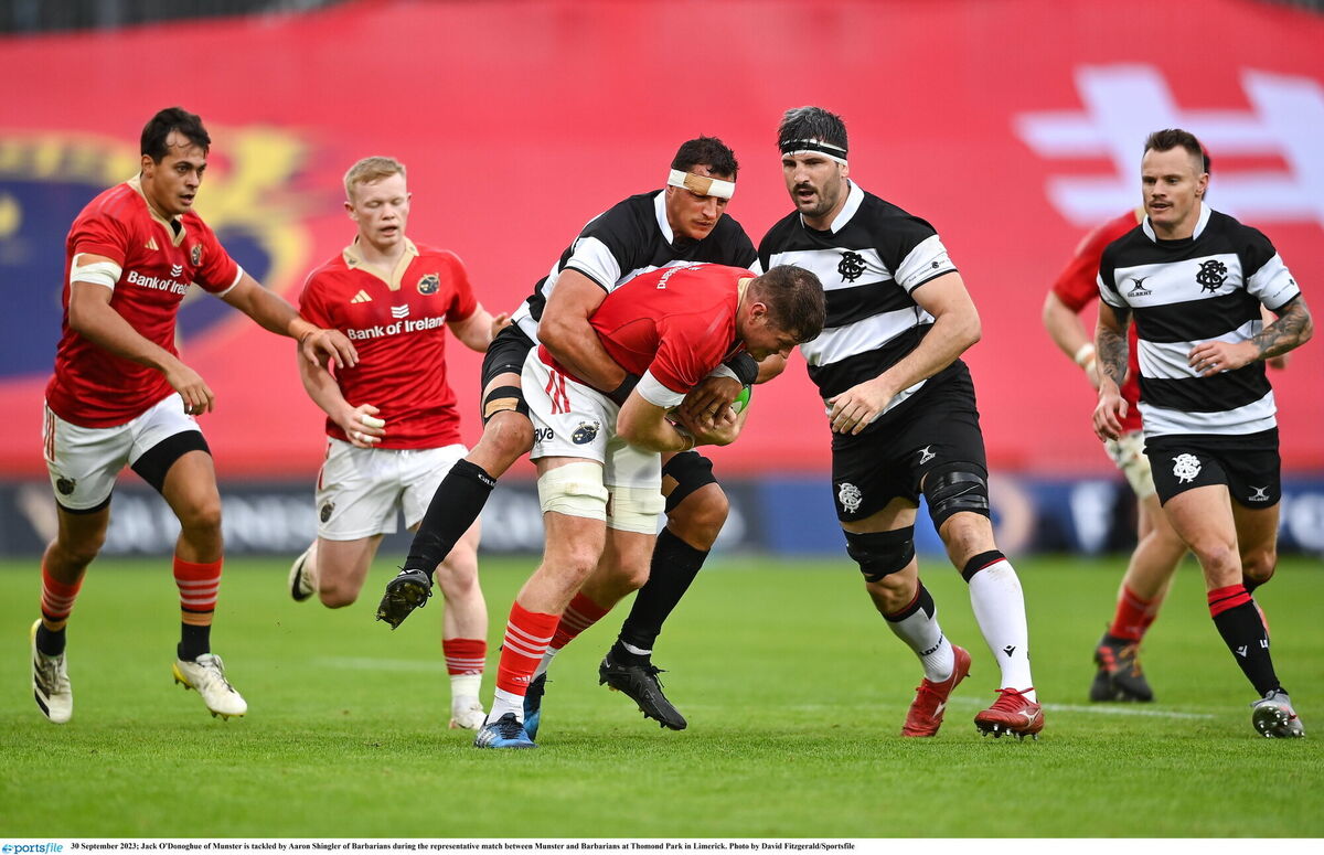 Jack O'Donoghue of Munster is tackled by Aaron Shingler of Barbarians during the representative match between Munster and Barbarians at Thomond Park in Limerick. Photo by David Fitzgerald/Sportsfile