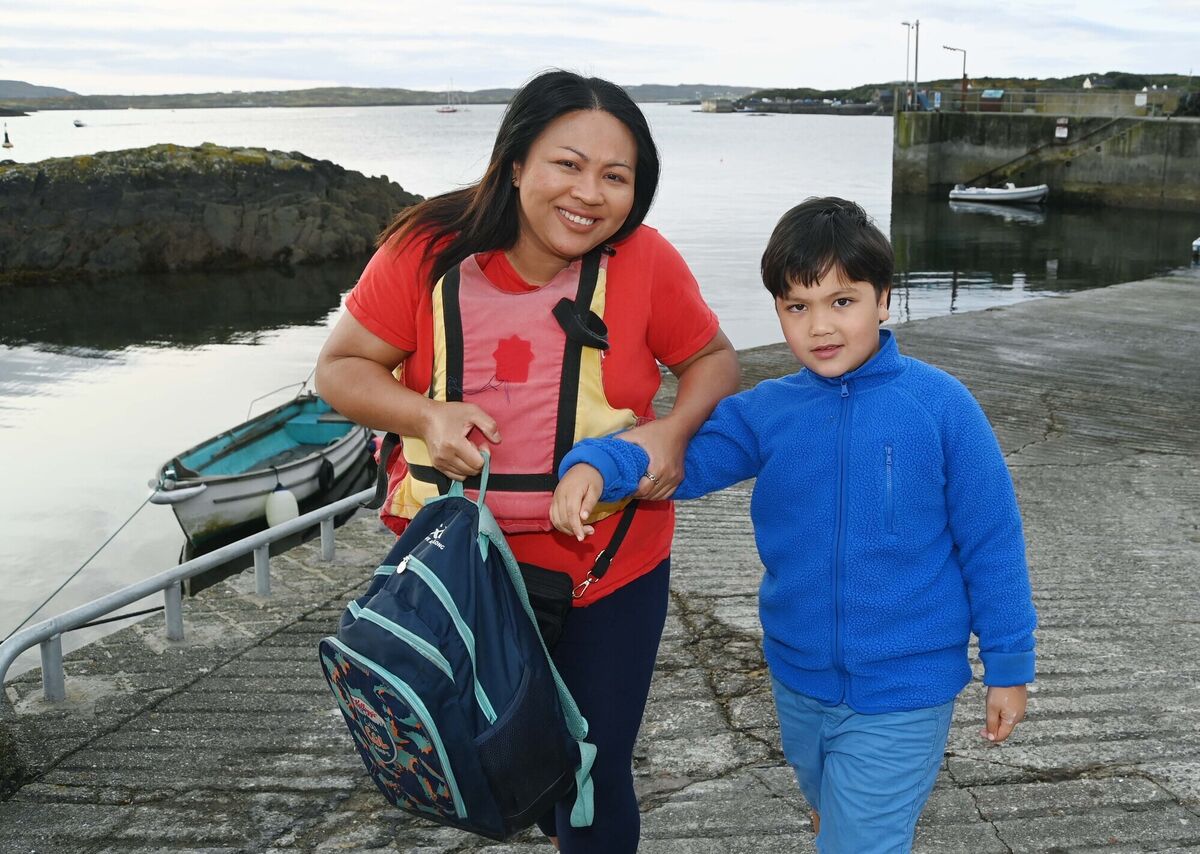Amm McCormack at Cunnamore after arriving from Heir Island in West Cork with her son Finn on his way to school. Amm McCormack at Cunnamore after arriving from Heir Island in West Cork with her son Finn on his way to school.