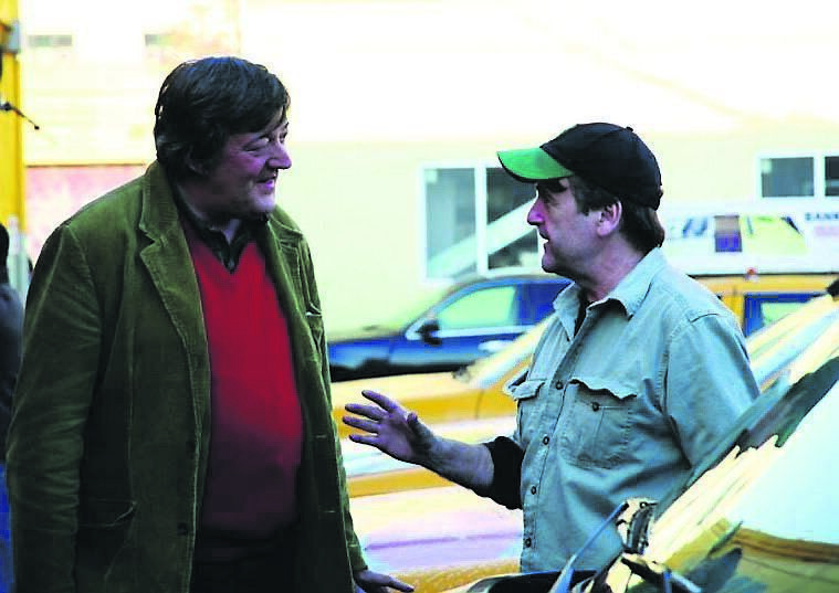 ohn with TV presenter Stephen Fry. ohn with TV presenter Stephen Fry.