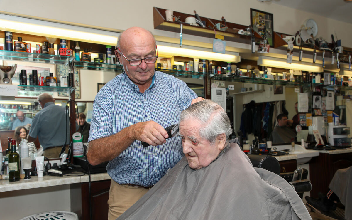 Michael O'Brien having his hair cut for a family wedding by barber Mick Moriarty (The Baldy Barber) at his salon on Great William O'Brien Street, Cork.- Picture: David Creedon Michael O'Brien having his hair cut for a family wedding by barber Mick Moriarty (The Baldy Barber) at his salon on Great William O'Brien Street, Cork.- Picture: David Creedon
