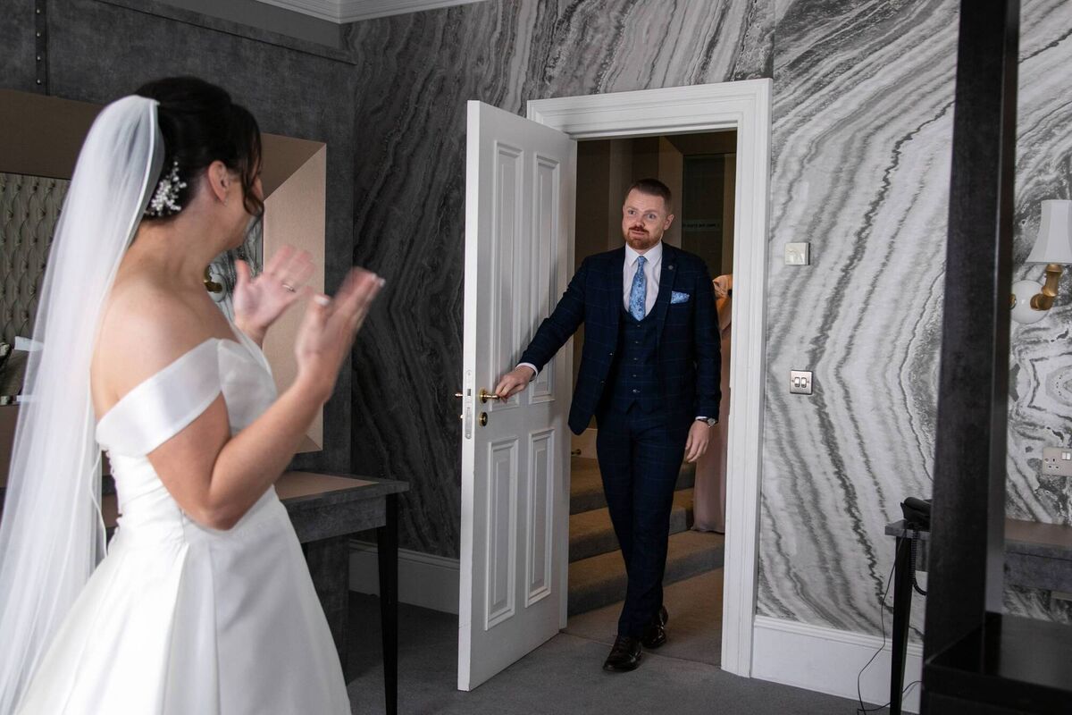 The couple decided to have a first reveal in the bridal suite, rather than wait until the ceremony. The couple decided to have a first reveal in the bridal suite, rather than wait until the ceremony.
