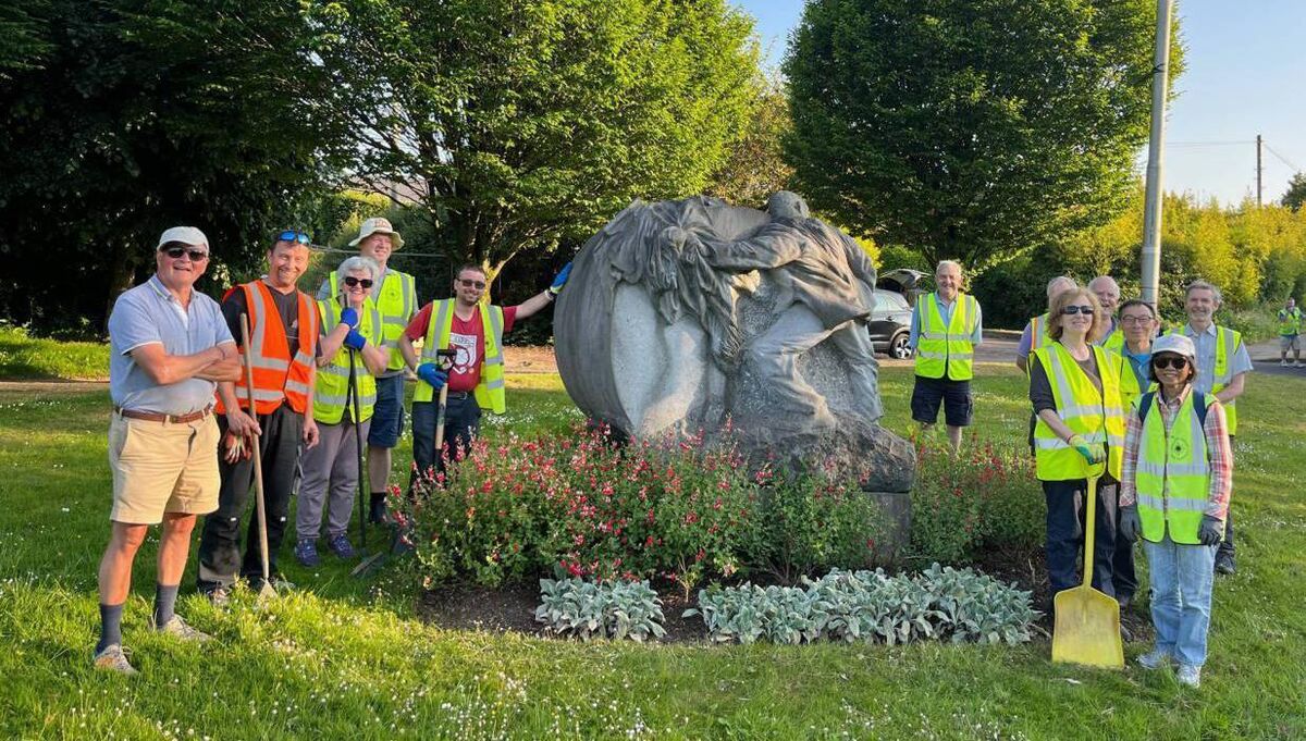 Some of the members of Ballincollig Tidy Towns group beside one of the landmarks they keep spruced up