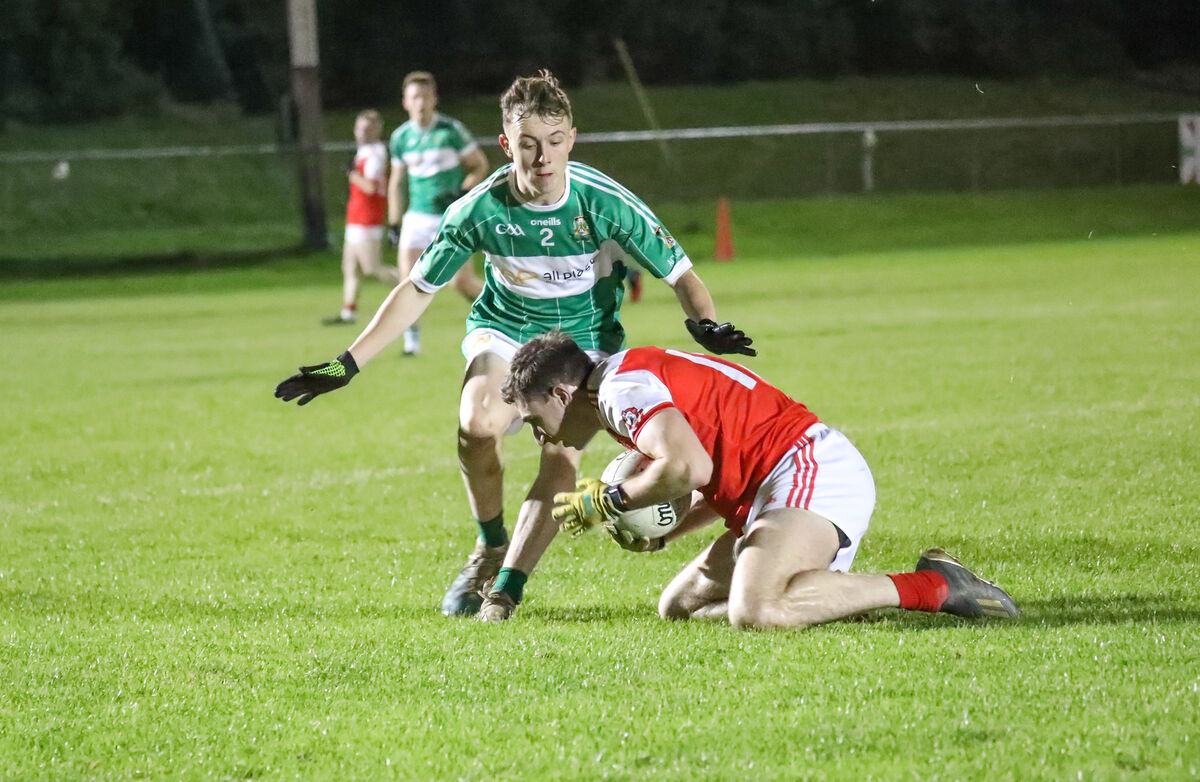 Dromtarriffe's Michael Healy on the ground and blocked by Aghabullogue's Brendan O'Sullivan during the IAFC semi-final. Picture: David Creedon