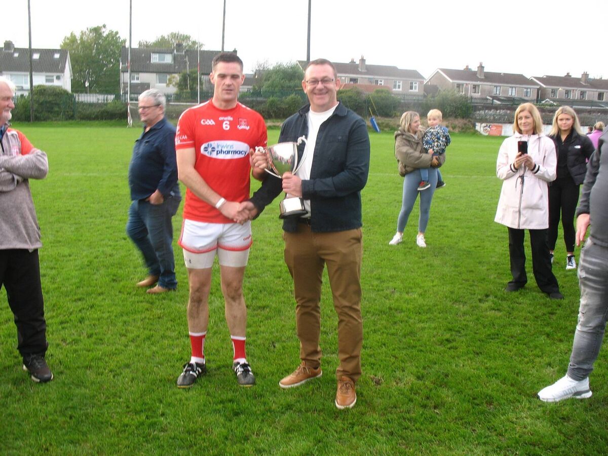 Brian Twomey, Seandún treasurer, presenting the trophy to Mayfield football captain Dave Malone. Brian Twomey, Seandún treasurer, presenting the trophy to Mayfield football captain Dave Malone.