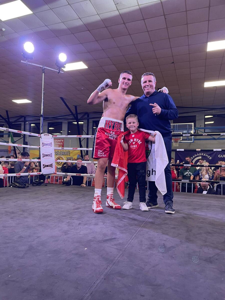 Tommy the Governor Hyde with his father Gary and mascot Joey O’Connor after another superb performance beating Mexican fighter Abraham Hernandez at the Gurranabraher Credit Union Arena last Saturday night.