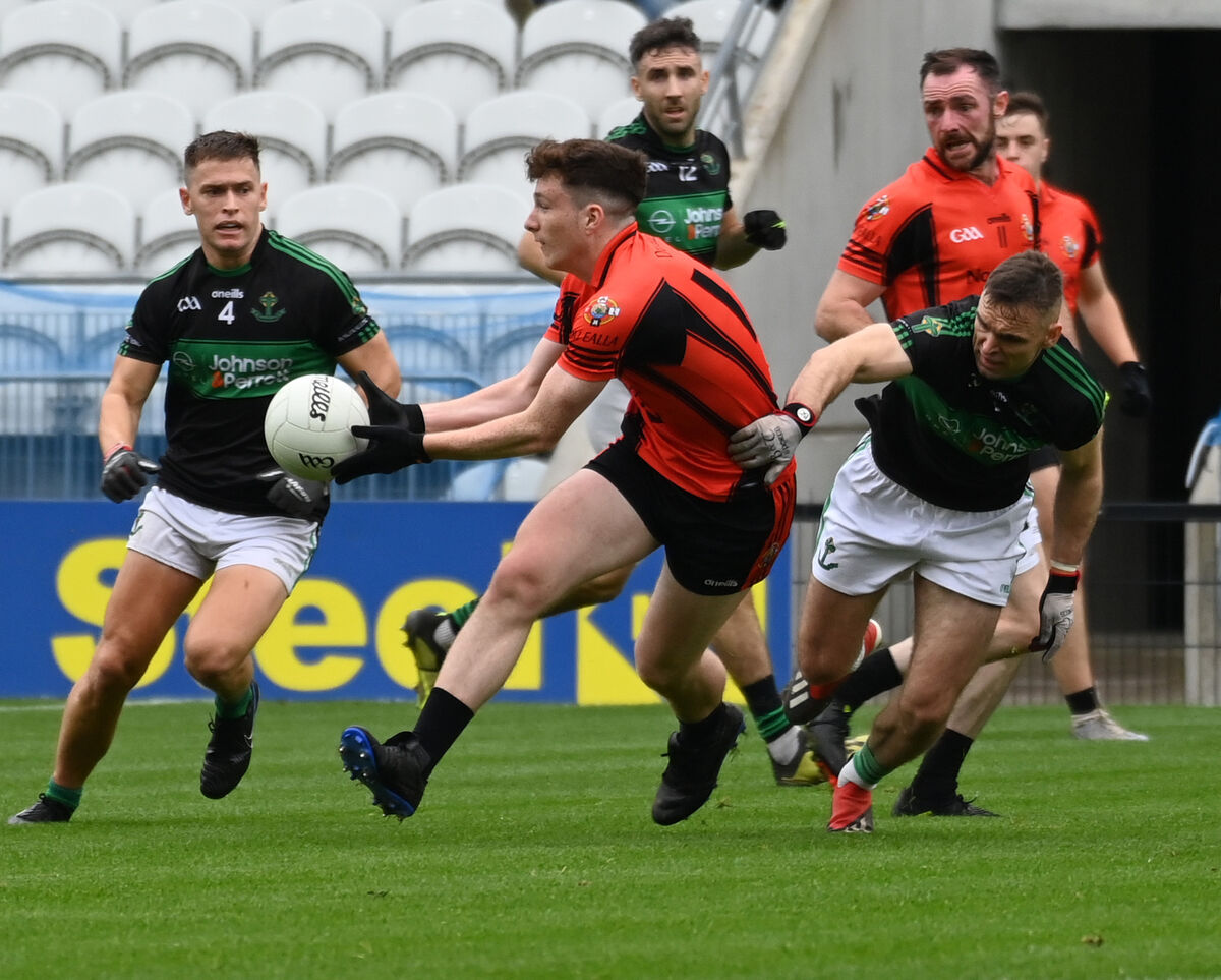 Duhallow's Luke Murphy gathers the ball from Nemo Rangers' Kieran Histon and Kevin O'Donovan. Picture: Eddie O'Hare Duhallow's Luke Murphy gathers the ball from Nemo Rangers' Kieran Histon and Kevin O'Donovan. Picture: Eddie O'Hare