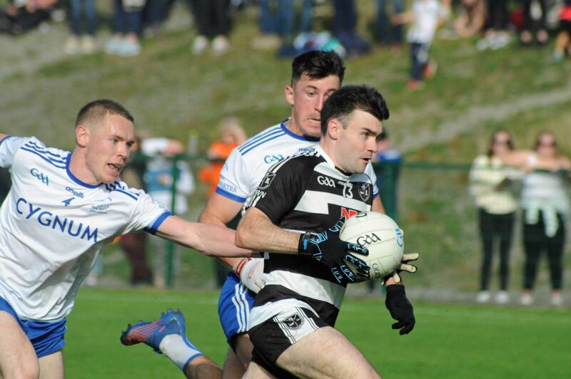 Gary Murphy of Castletownbere closing in on goal despite the close attention of Cill Na Martra's Finén Ó Faoláin and Tadhg Ó Corcora. Picture: Tony McElhinney Gary Murphy of Castletownbere closing in on goal despite the close attention of Cill Na Martra's Finén Ó Faoláin and Tadhg Ó Corcora. Picture: Tony McElhinney