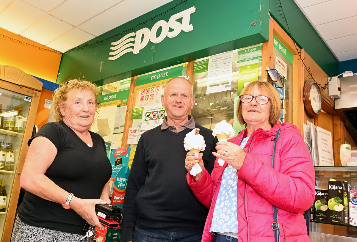 Denis O'Flynn, postmaster with customers Norma Scully and Josphine O'Keeffe at Ladysbridge post office in East Cork. Picture; Eddie O'Hare