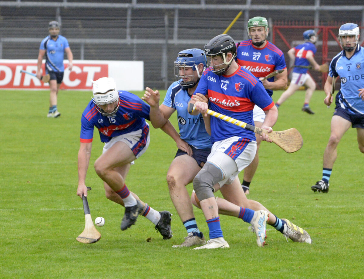  Erin's Own duo John Kavanagh and Alan Bowen hold off Barryroe's Cathal Sheehy. Picture: Denis Boyle