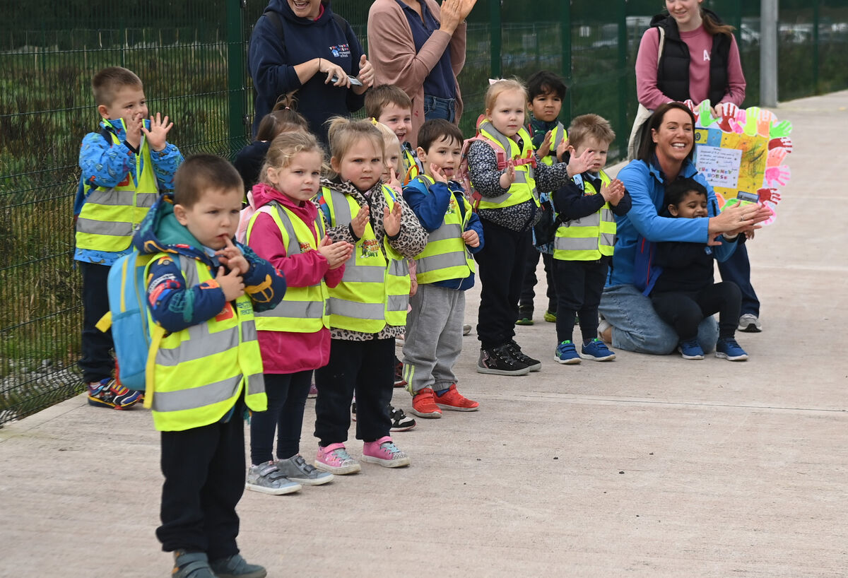 pre school children watch as pupils from Carrigtwohill Community National School moved from their pre-fab buildings at the GAA club to their new premises. Picture; Eddie O'Hare