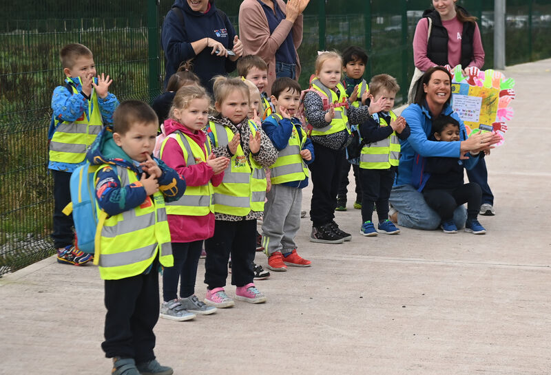 pre school children watch as pupils from Carrigtwohill Community National School moved from their pre-fab buildings at the GAA club to their new premises. Picture; Eddie O'Hare