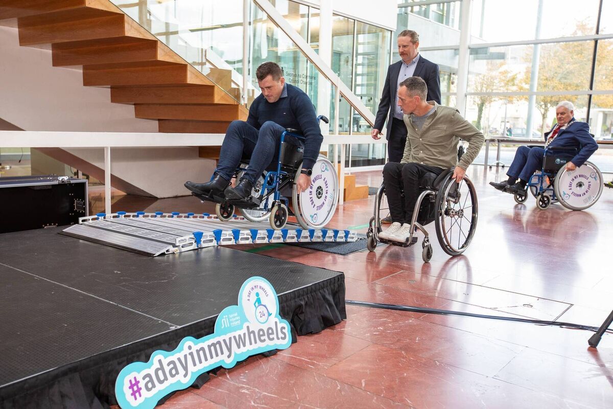 Rugby player CJ Stander attempting to get up a ramp at A Day In My Wheels event.