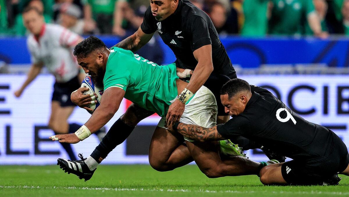 Ireland's Bundee Aki drives at New Zealand's Rieko Ioane and Aaron Smith. Picture: INPHO/Dan Sheridan