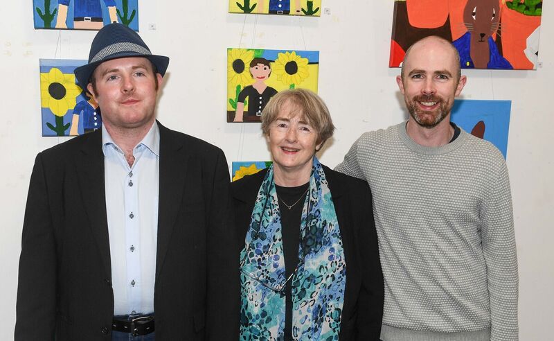 Artist Matthew Sexton, left, with his mum Jenny and brother Gerard, at the launch of his art exhibition at Bishopstown Library. Picture: David Keane.
