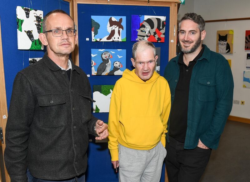 Jerry Carmody, Eoin Barrett and Donal O'Connell, attending the launch of the art exhibition.