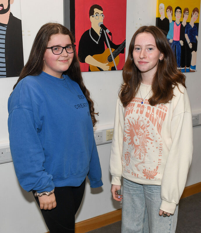 Amelie Quinn and Laura Dullea, enjoying the launch of the art exhibition of Matthew Sexton at Bishopstown Library. Picture: David Keane