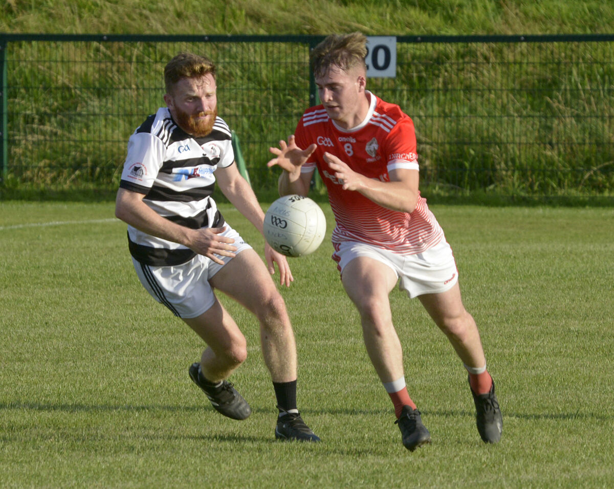 Urhan's Alan Elphick and St Nick's David Dunlea. Picture: Denis Boyle